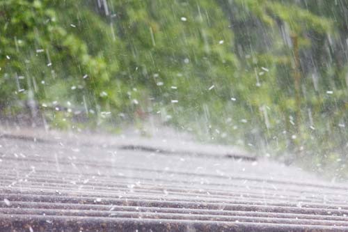 Hail hitting a roof.